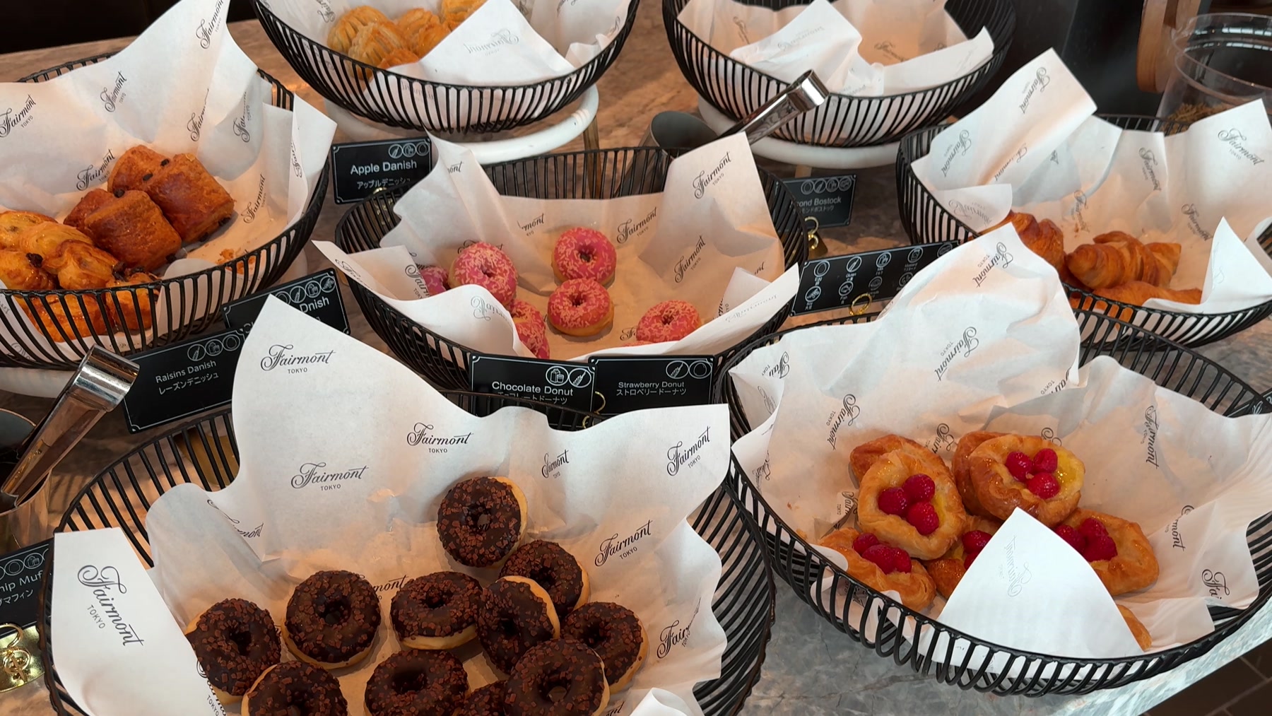 Breakfast pastries and doughnuts on display at Fairmont Tokyo