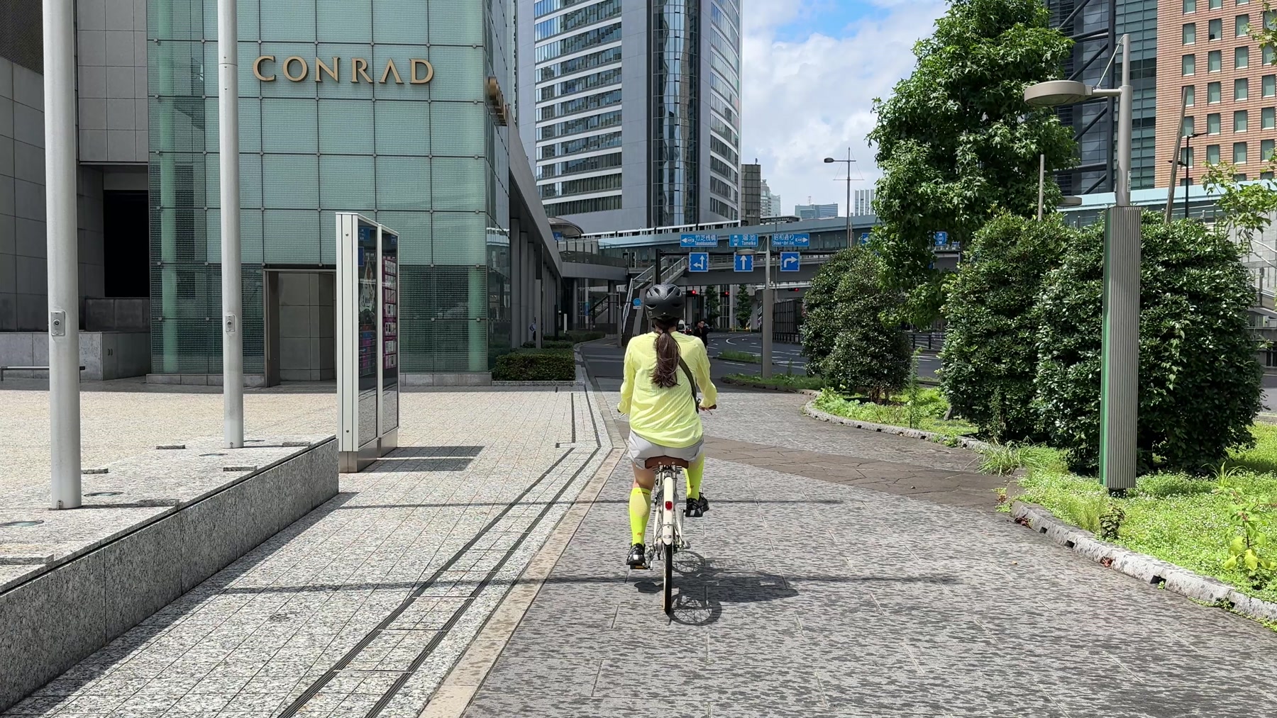 Riding a Fairmont rental bicycle along a landscaped path in Tokyo