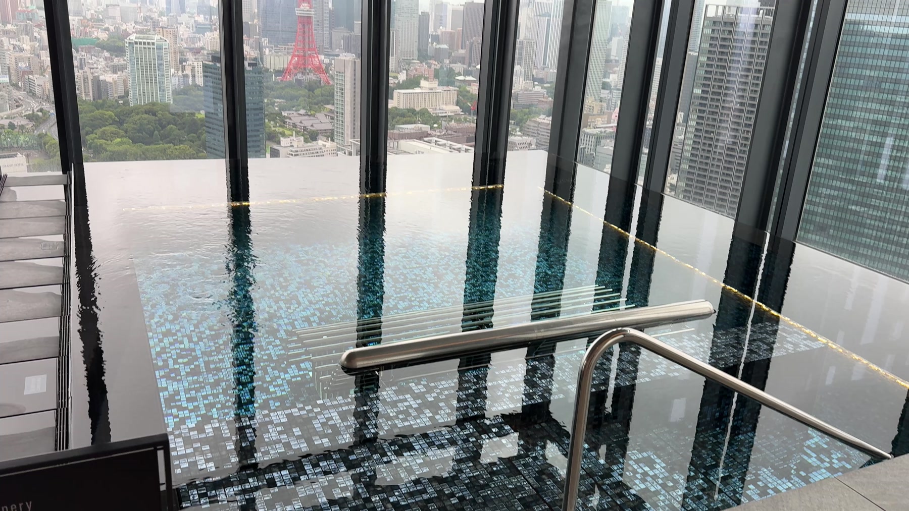 Indoor infinity pool and Tokyo skyline at Fairmont Tokyo