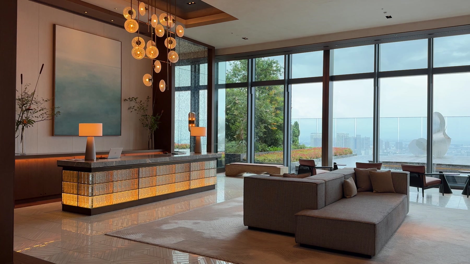 Fairmont Tokyo main lobby with a reception desk, seating and large skyline windows