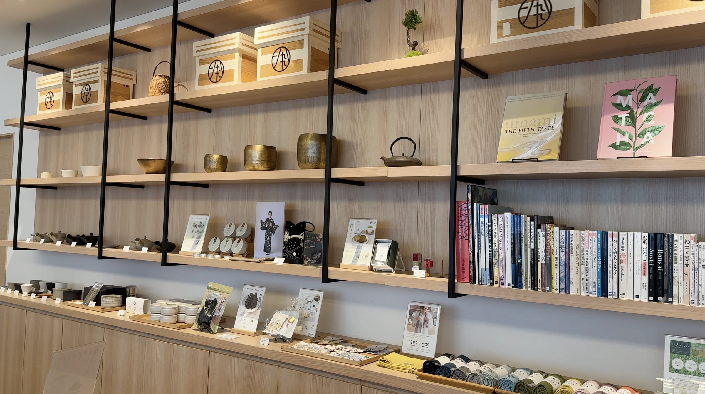 Wooden display shelves with teaware, books and gifts at Hotel 1899 Tokyo
