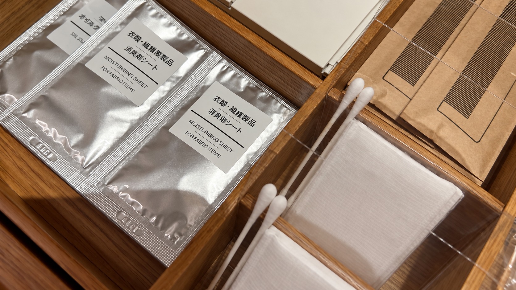 Individually wrapped fabric deodorizing sheets, cotton pads and cotton buds in the room drawer