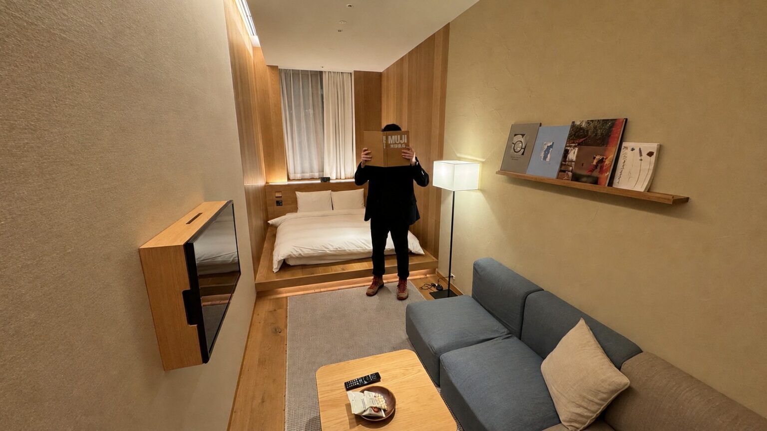 Our MUJI HOTEL GINZA Type C room, showing the sofa, low table and raised double bed