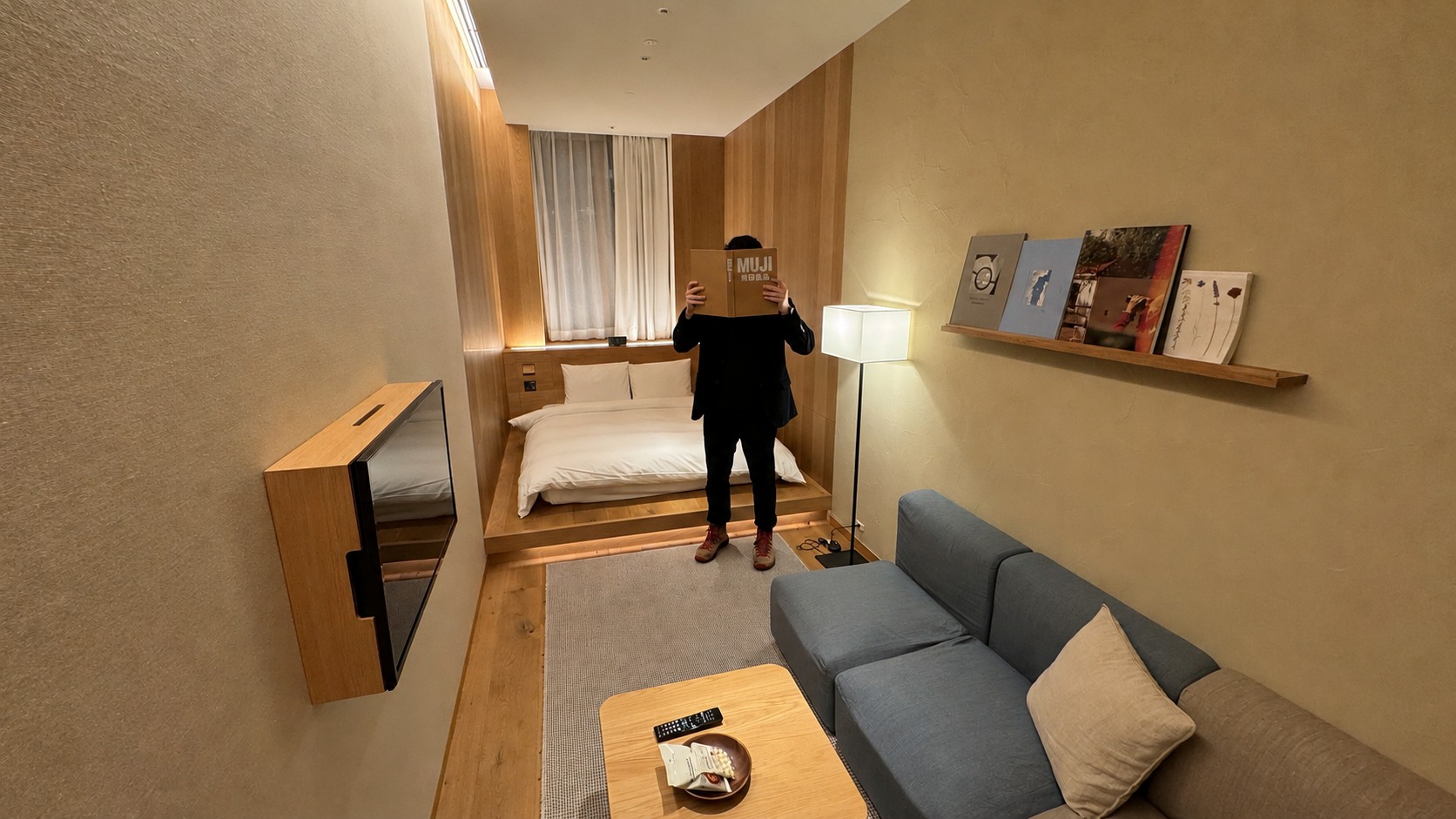 Our MUJI HOTEL GINZA Type C room, showing the sofa, low table and raised double bed