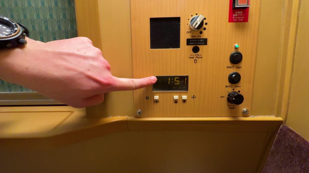 Bedside alarm and lighting controls inside our Sunrise Express Single room